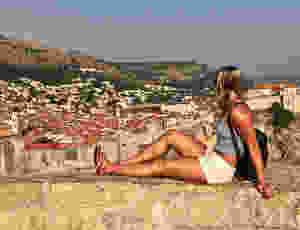 my daughter lounging on the Dubrovnik city walls