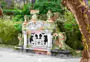 an ornate bench between the palace and the chapel