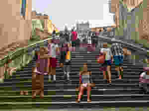 my daughter on the Jesuit Staircase on a busy summer day