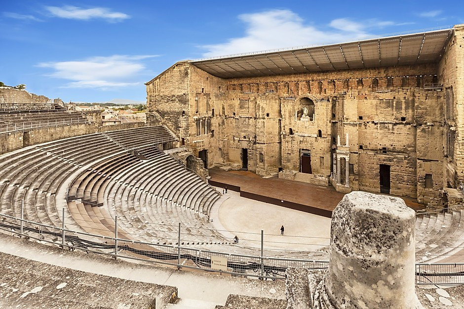 Orange Amphitheater in Provence France, with a statue of Augustus center stage lording over the scene