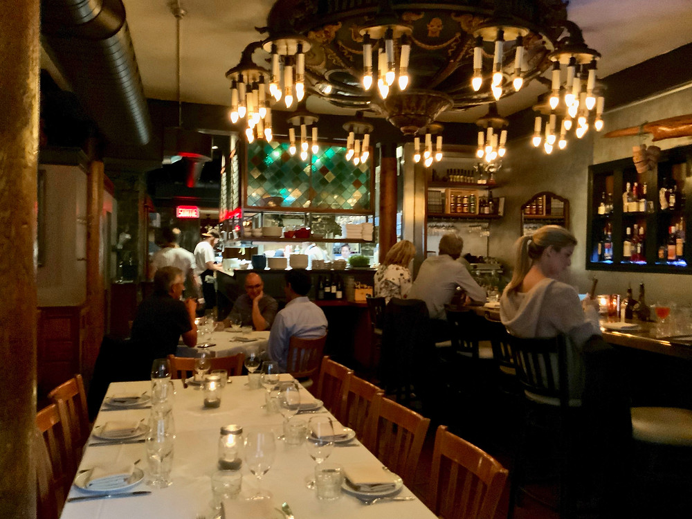 Garde Manger, with a massive period chandelier dominating the room