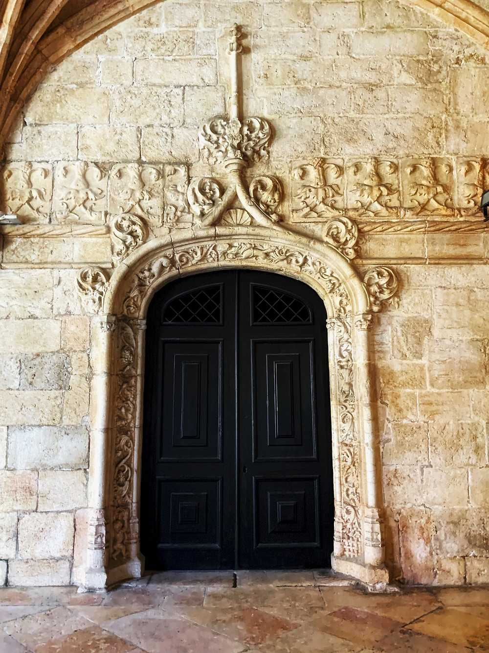 a Manueline door in the cloisters of Jeronimos Monastery in the Belem neighborhood of Lisbon