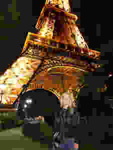 me enjoying the Eiffel Tower at night before the glass wall was installed