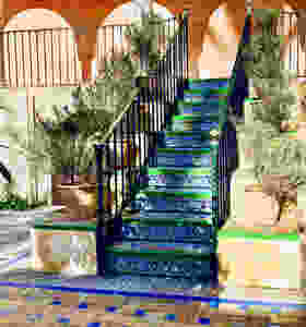 a beautiful staircase in the Alcazar Gardens