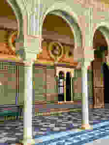 Mudejar arches and azulejo tiles in the courtyard of Casa de Pilatos
