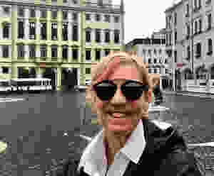 me on the Rathausplatz in Augsburg, getting rained on during a German fall.