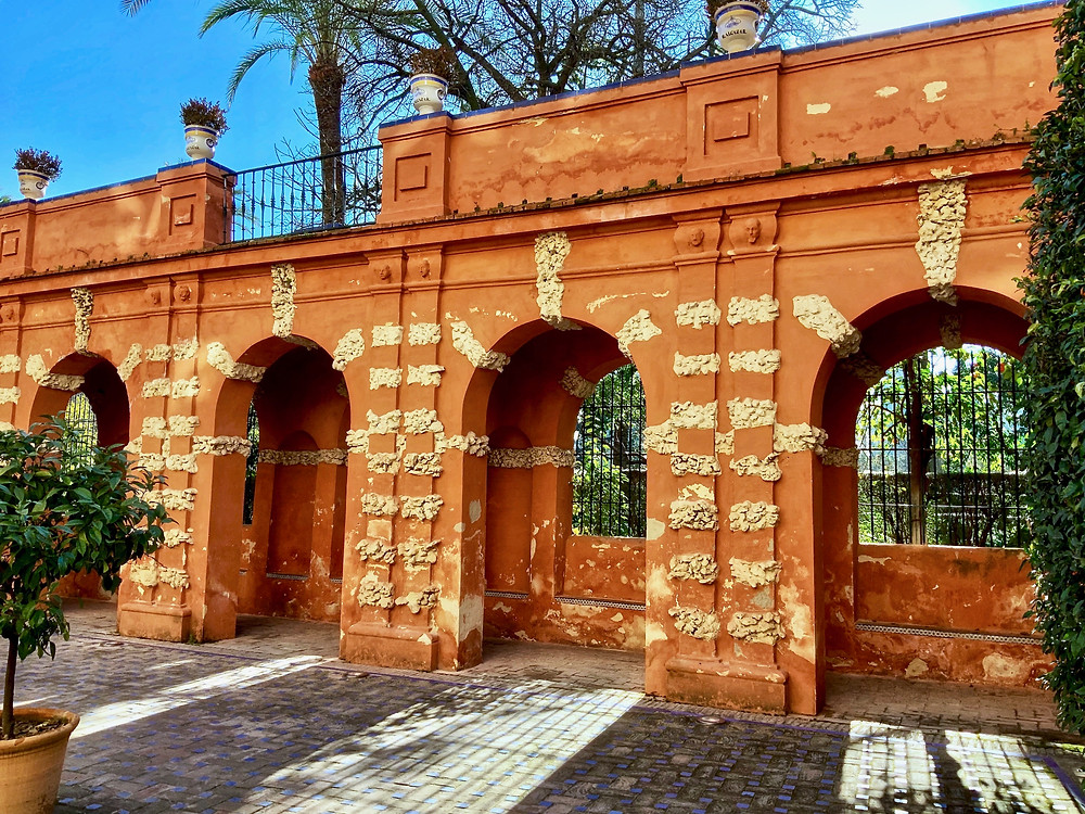 orange grotto walls in the Alcazar Gardens in Seville