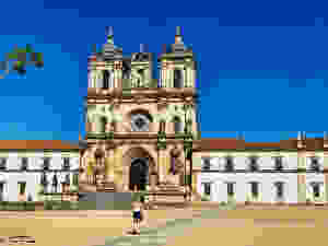 my daughter heading to the entrance of Alcobaca Monastery