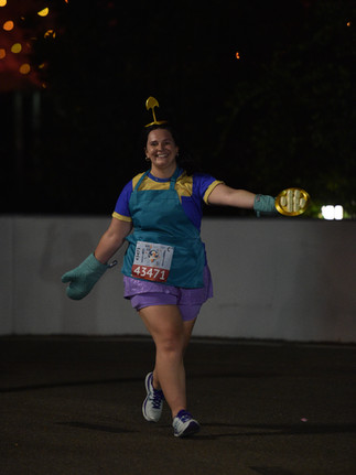 A runner posing in a Chef Kronk costume