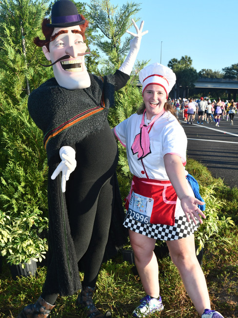 A runner posing with Bowler Hat Guy