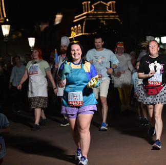 A runner in a Chef Kronk costume