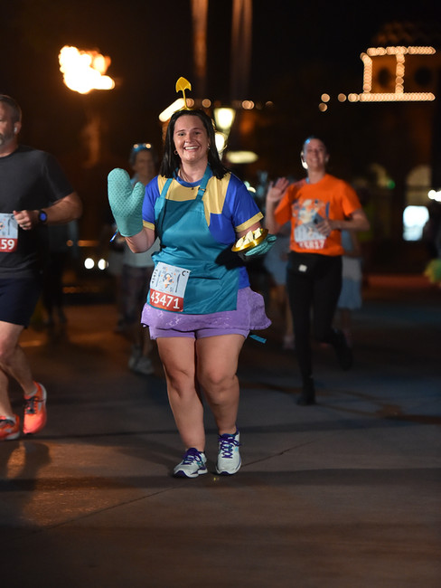 A runner in a Chef Kronk costume