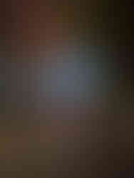 A runner posing in front of Spaceship Earth