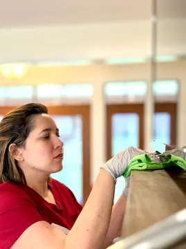 Maid performing regular home cleaning in Washington DC