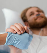 close-up-patient-health-worker-holding-h