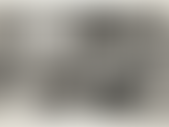 Older man reads a large book in a cozy study filled with wooden furniture, bookshelves, and a fireplace. Window shows snowy landscape.