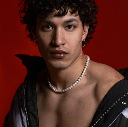 Editorial portrait of a man with curly hair