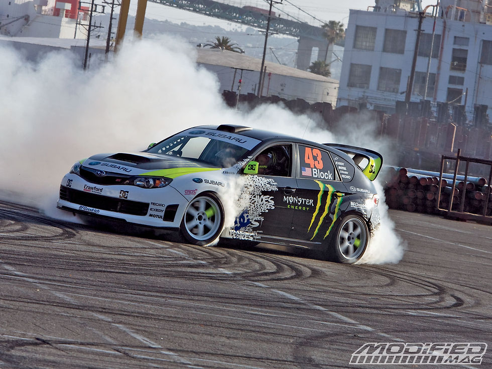 modp_0909_22_o+2009_subaru_impreza_sti+drifting.jpg