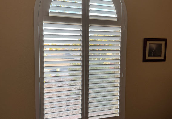 Custom Norman arch plantation shutters installed in a Tucson AZ home