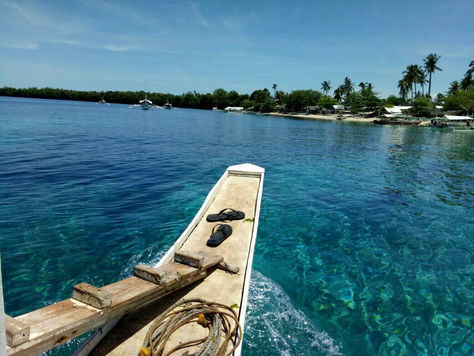 Boat sailing in turquoise waters