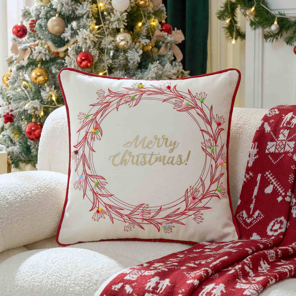 White Merry Christmas cushion with embroidered festive wreath design