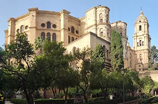 Facade of the cathedral of Malaga observed in the distance before beginning the guided tour inside.