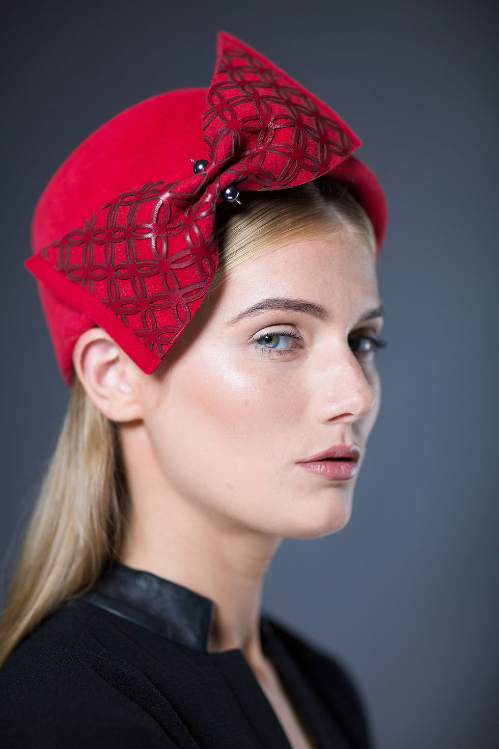 Thumbnail: Panji felt pillbox hat with large bow with geometric pattern and two pearls at centre