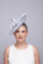 Lili saucer hat with sinamay loops and silk lily