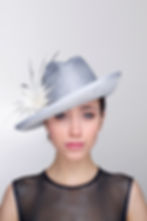 Volante smart trilby hat with transparent brim, spikey feather flower and colour graded arrowheads