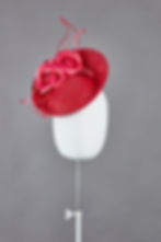 Agate small tilted saucer hat with spray of silk camellias - front view