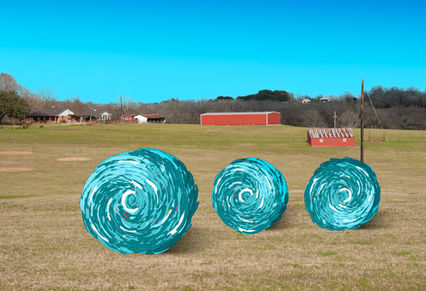 Three hay bales transformed into turquoise swirls in a Texas pasture.