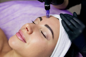 Beautician makes mesotherapy injections. Microneedle mesotherapy. Treatment of a woman by