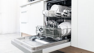 Dishwasher loaded with clean dishes, illustrating expert tips for maximizing dishwasher efficiency in a Toronto home.