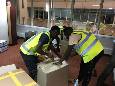 DG Movers experts packing office items for a client.