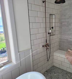 Master Shower tile installation with bench.