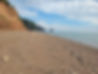 Rock lined beach and ocean