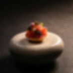 Salmon tartare with caviar and herbs on a stone