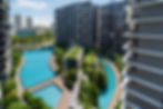 Modern residential complex with winding pools and landscaping