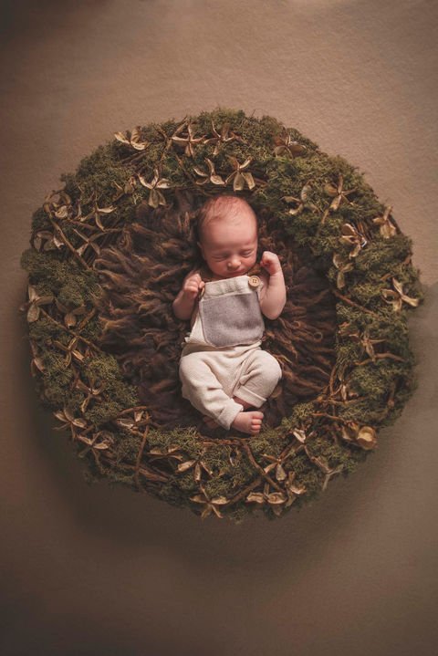 Newborn photoshoot baby in a cute reef.jpg