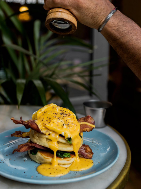 Benedict pancakes at Cremat 11 brunch spot in Barcelona