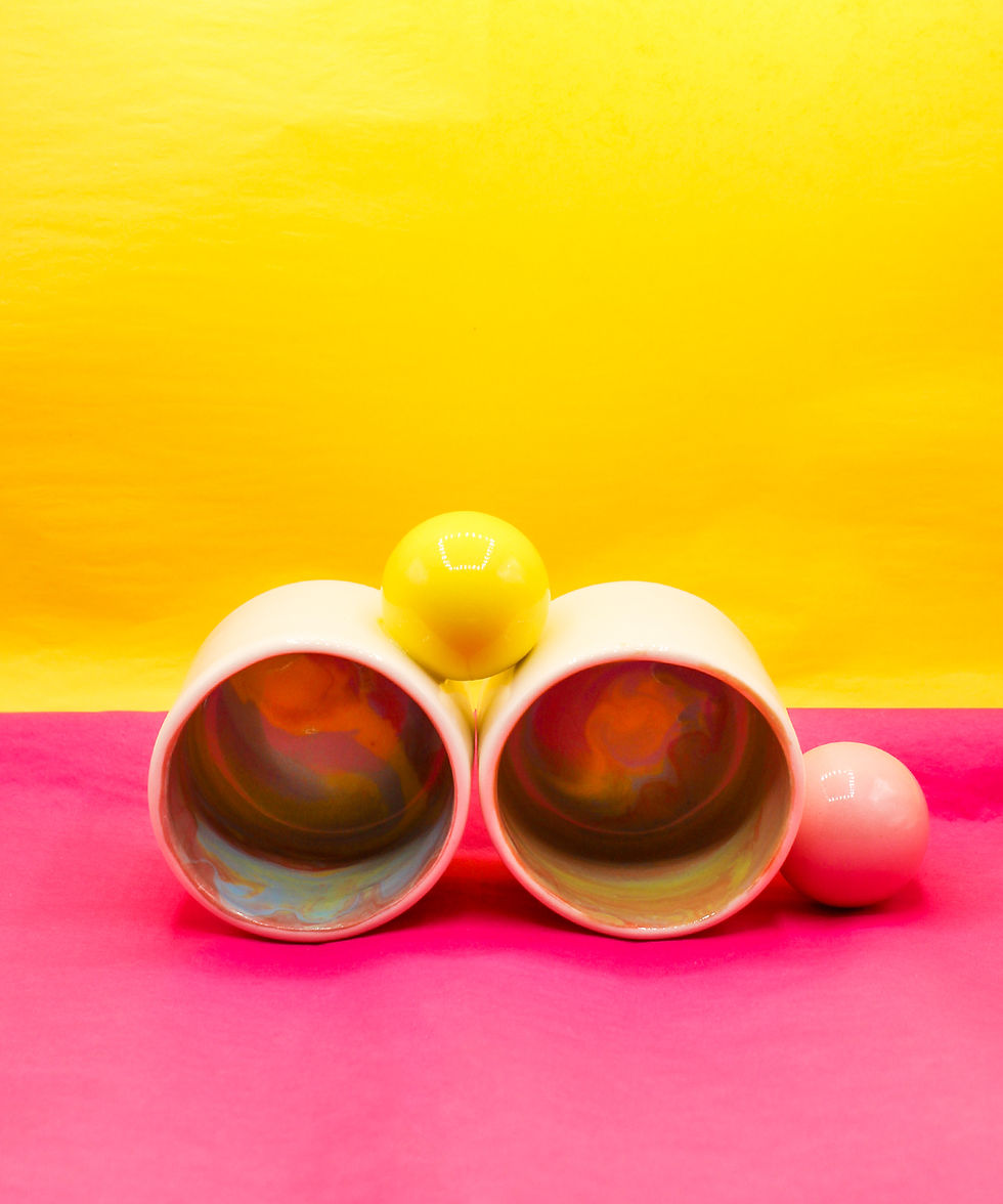 Handcrafted cups with colorful circle handles by KOLOS ceramics