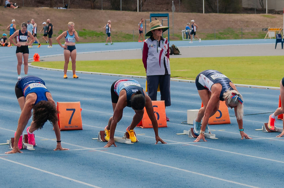 Female athletes on the blocks ready to start the race