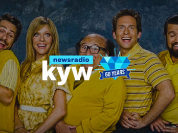 The Gang standing against a background and KYW NewsRadio logo.