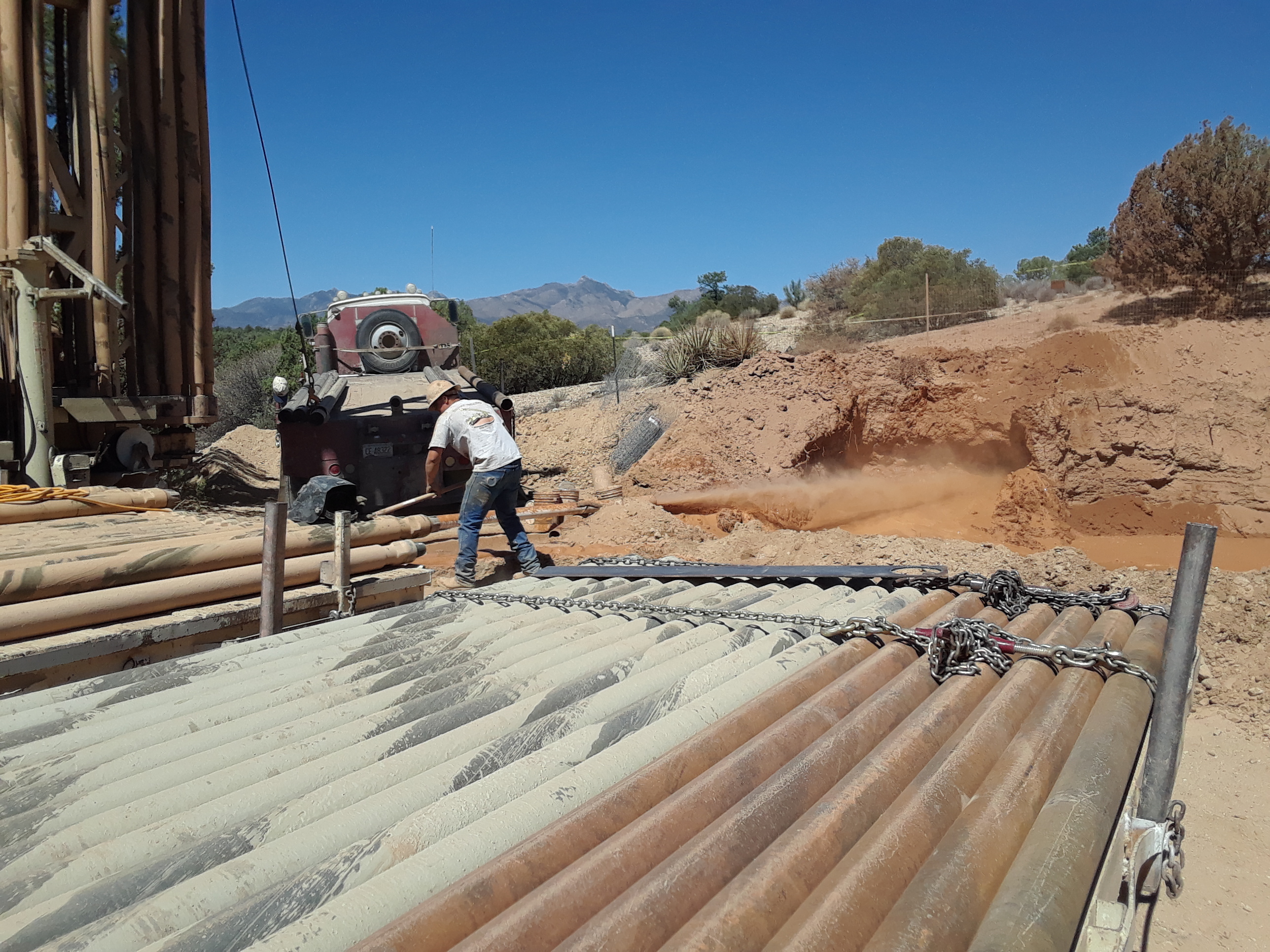 Successful drill rod recovered from precollar drilling replaced with casing