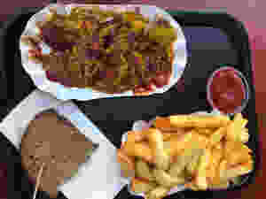 Vegan Curry wurst and french fries in Germany.