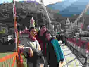 Family posing on the bridge in Rishikesh, India.
