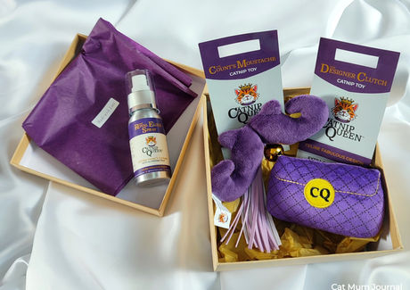 A box of Catnip Queen soft cat toys and catnip spray.