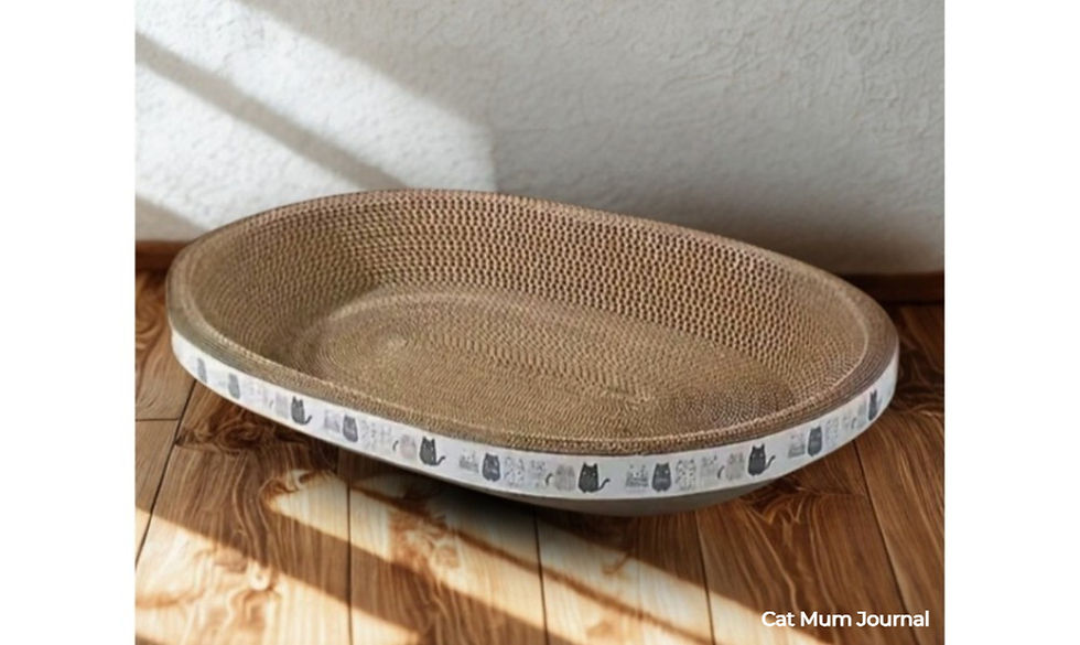 A brown, oval cat scratcher with a cat pattern on the edge.