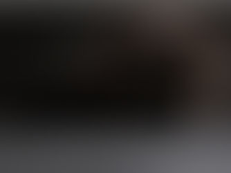 A black cat with yellow eyes.