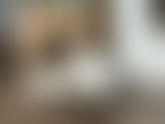 Cat sitting in a cardboard scratcher basket.